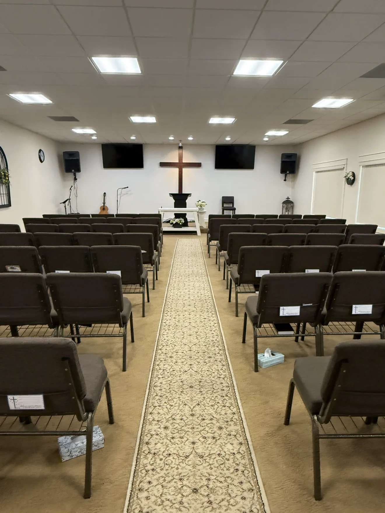 The sanctuary at The River, with seating facing the cross