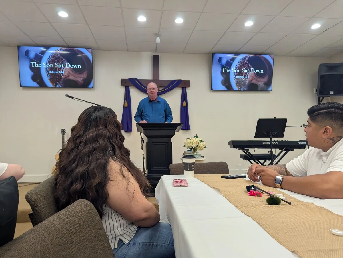 A speaker at the front of the church during a service