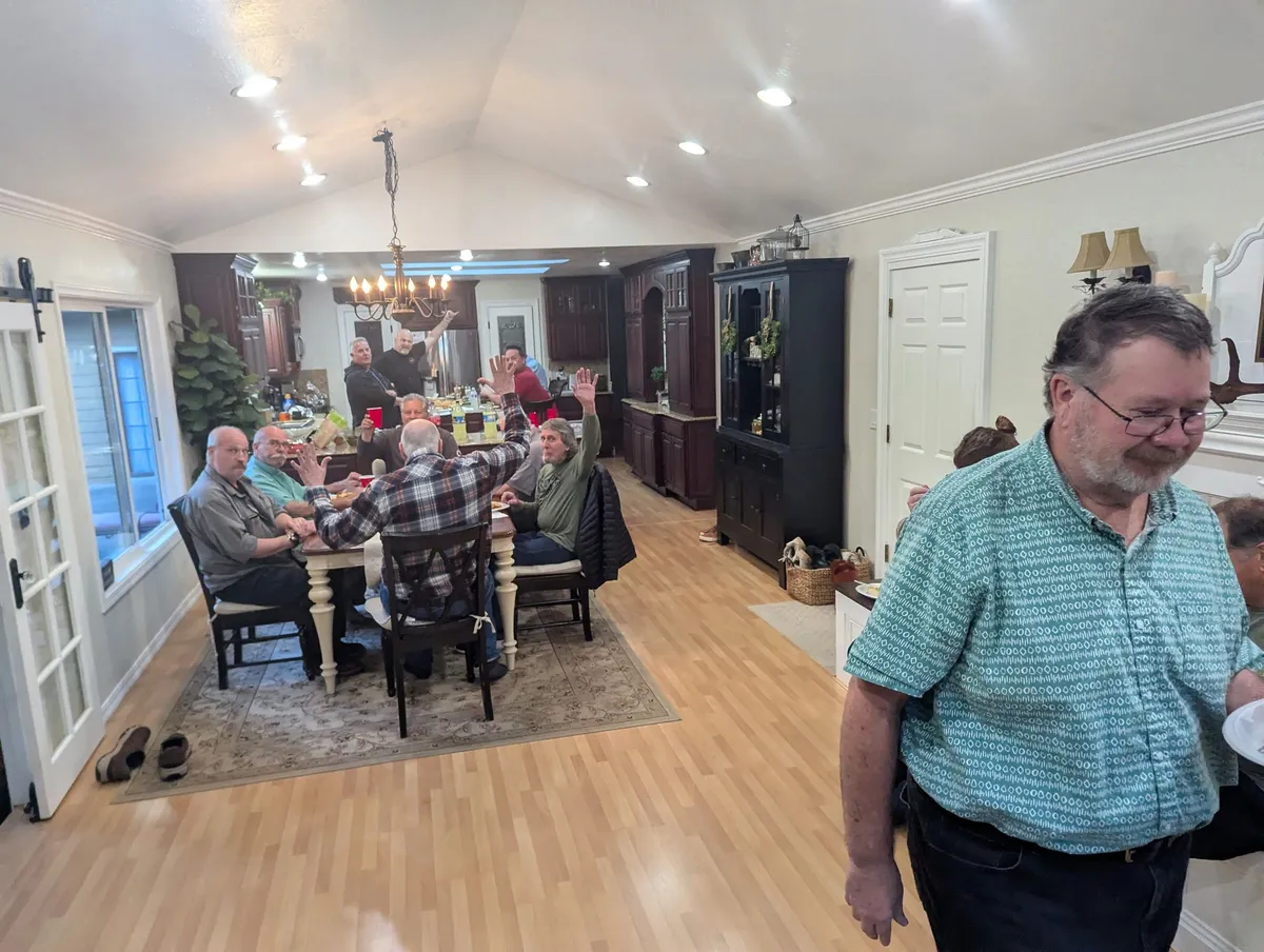 Church friends sharing a meal and conversation in a home